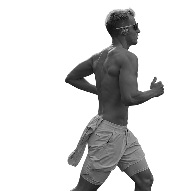 A runner mid-stride, in black and white